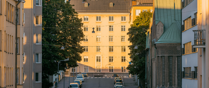 Apartment buildings on a Helsinki street in warm evening light