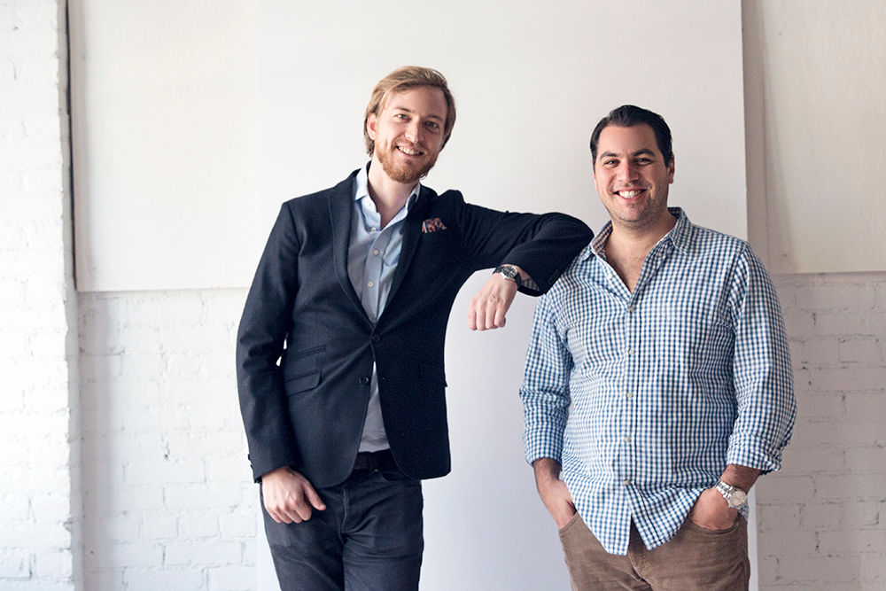 Henry Davis, left, and Matt Weiler standing together in a Glossier office