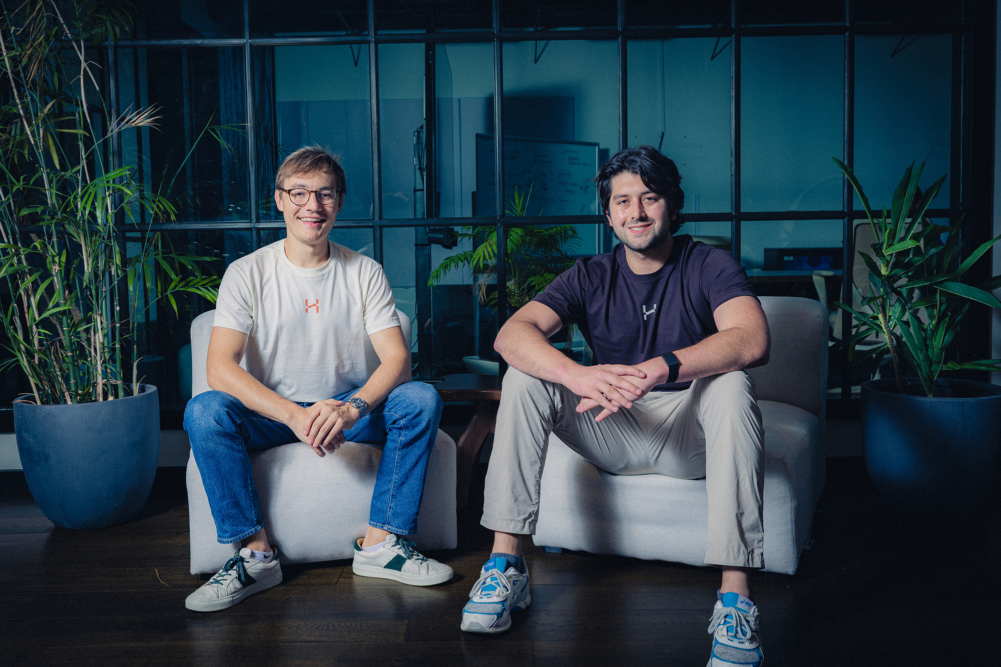 Henry co-founders Adam Pratt on the left and Sammy Greenwall on the right, seated in their office