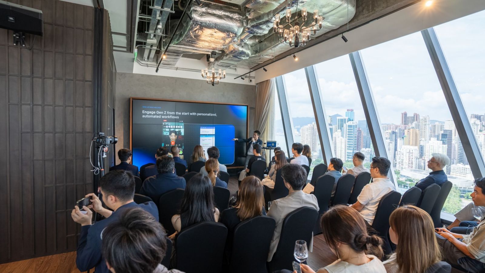 Henson Tsai presenting SleekFlow's automated workflows to an audience in Hong Kong