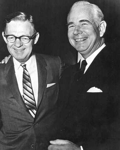 Herman Lay, left, and Donald M. Kendall smiling together in suits