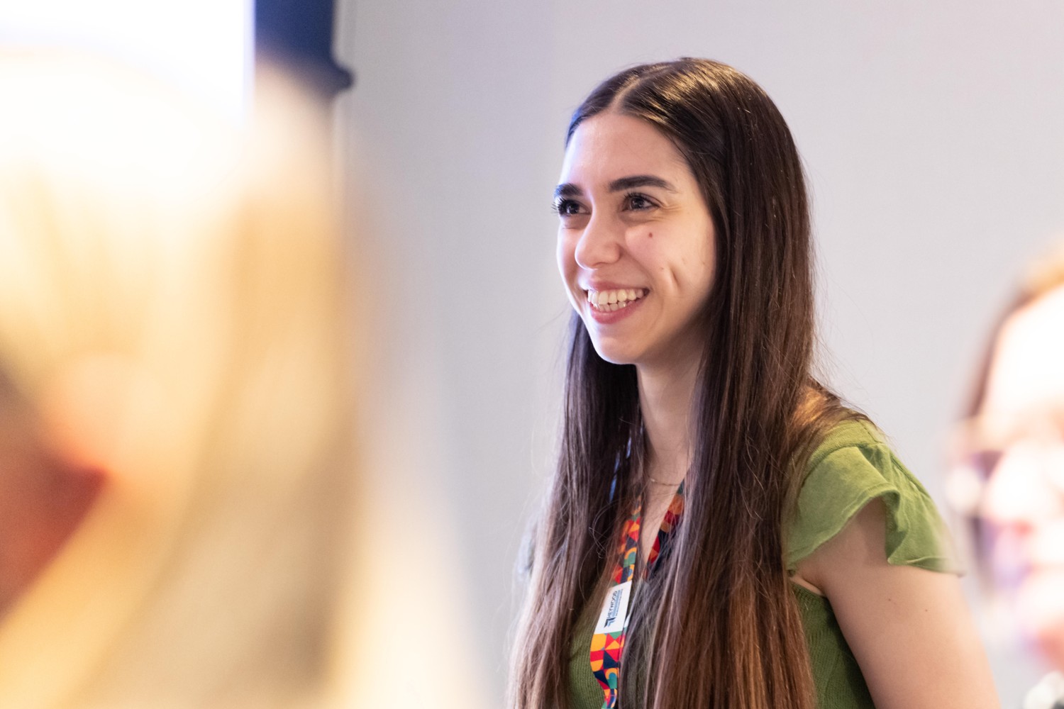 An attendee smiling during a conversation at Heywood’s 2022 CLASS conference