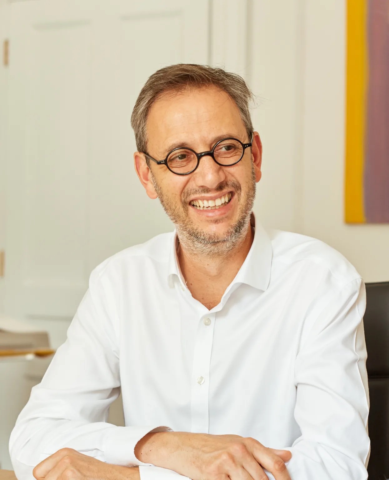 Highgate founder and CEO Thomas Eymond-Laritaz seated in his office