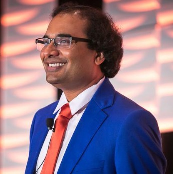 HighRadius founder and CEO Sashi Narahari in a blue suit and red tie