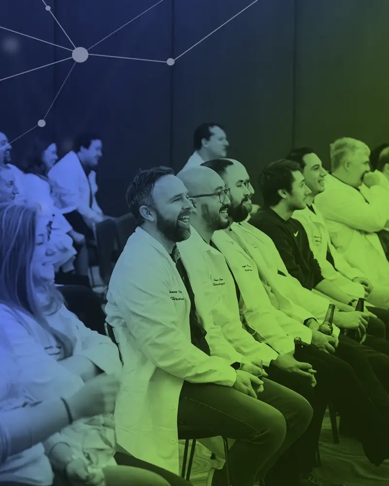 Hireology team members in lab coats at a company gathering