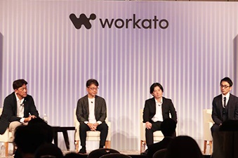 Four panelists seated on stage at Automate Tokyo 2024; Suzuki is second from the left