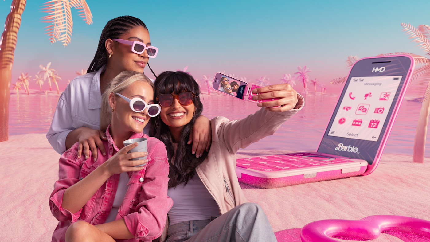HMD Barbie Phone lifestyle photograph with friends outdoors