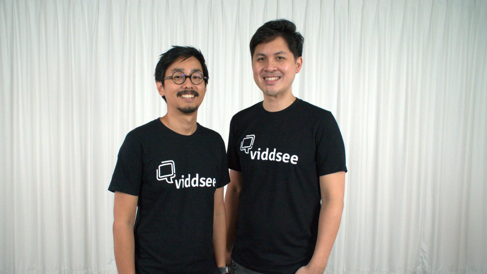 Ho Jia Jian, left, and Viddsee co-founder Derek Tan in matching company T-shirts