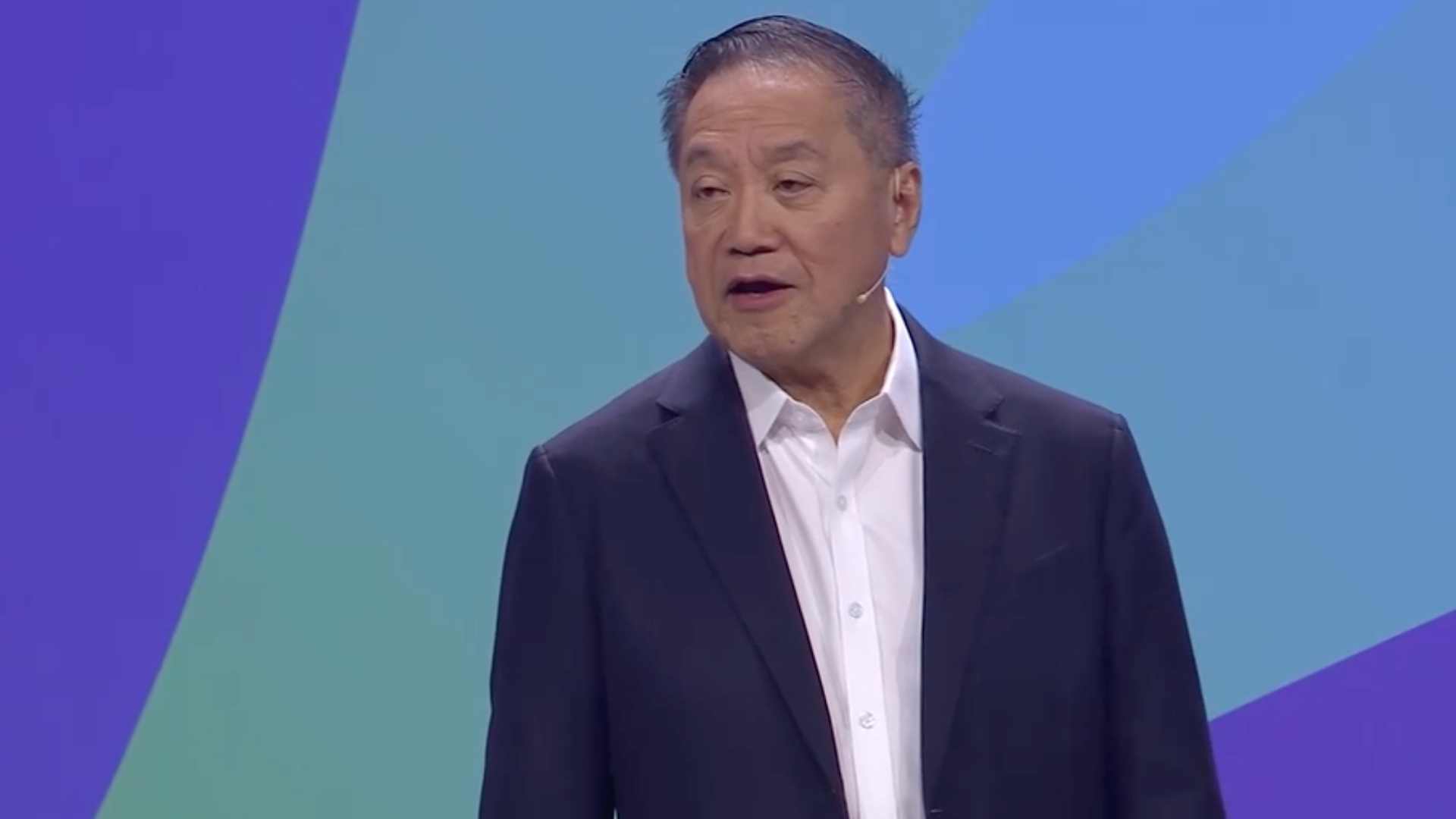 Hock Tan speaking on stage at VMware Explore 2024 in Las Vegas