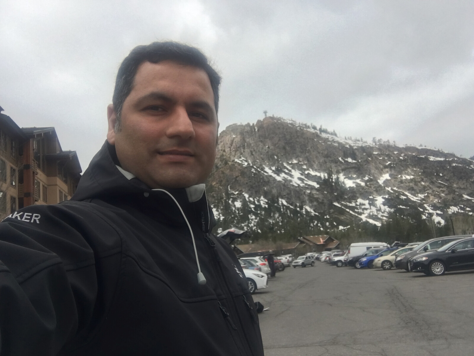 Hojjat Jafarpour outdoors near a snow-dusted ridge at Lake Tahoe
