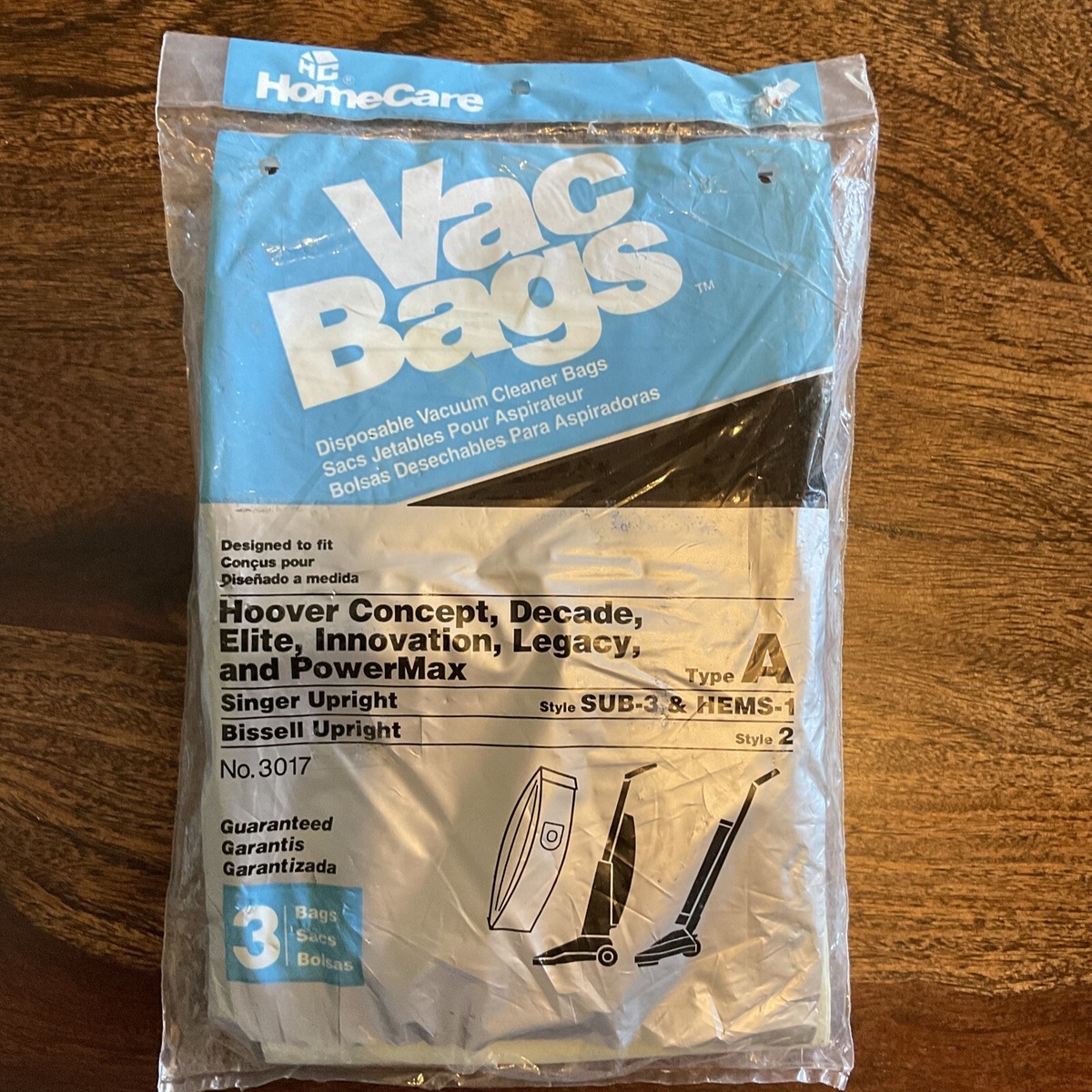 Historical blue HomeCare No. 3017 vacuum-bag packet listing compatible Hoover, Singer and Bissell models