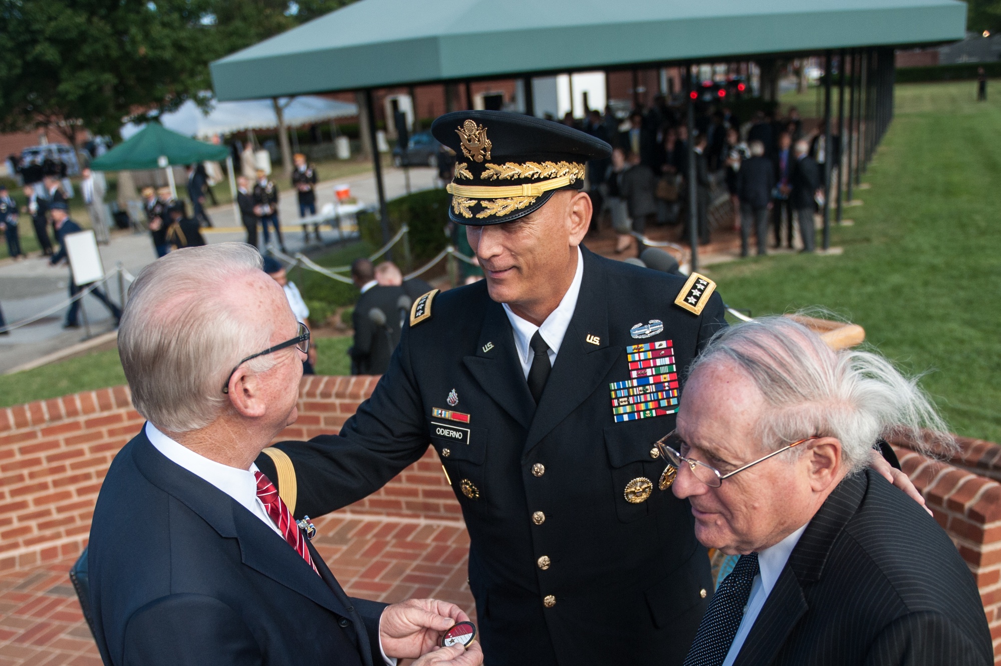 Buck McKeon, left, speaks with Army Chief of Staff Ray Odierno and Senator Carl Levin at a 2014 farewell tribute.