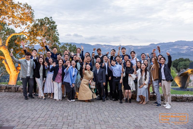 Participants in Hanwha’s 2024 Global Mentorship Camp pose together outdoors
