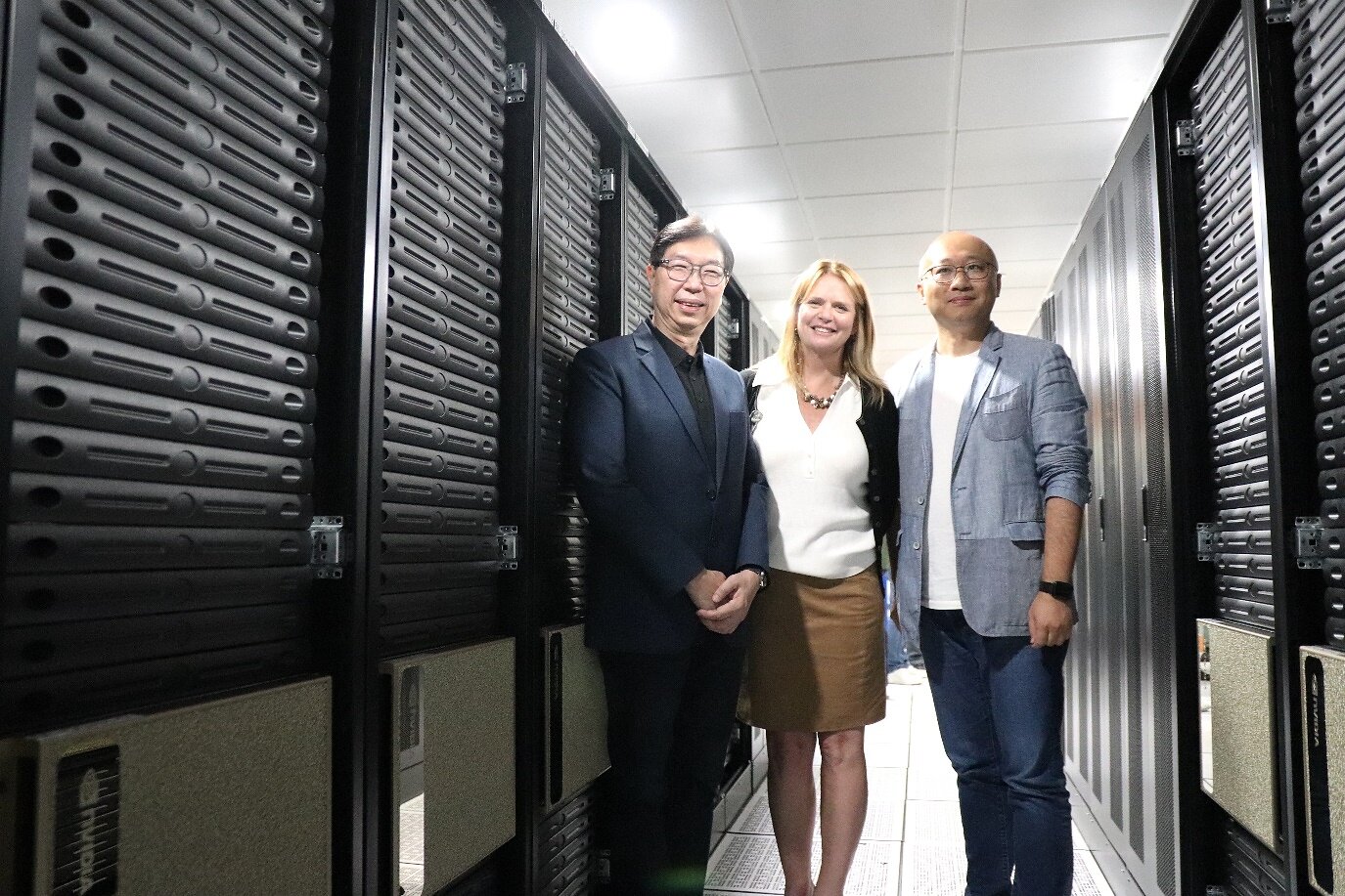 Huanbo Luan with NVIDIA representatives at the DGX H100 systems deployment