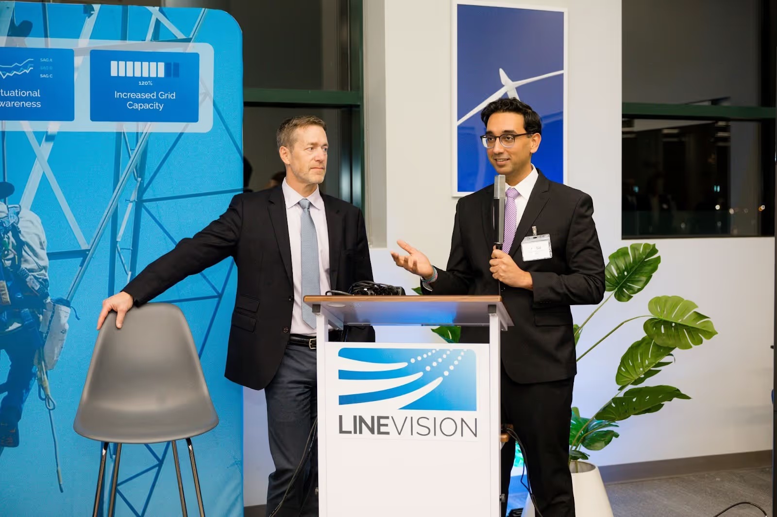Hudson Gilmer, left, beside GE’s Sal Gill speaking at a LineVision event