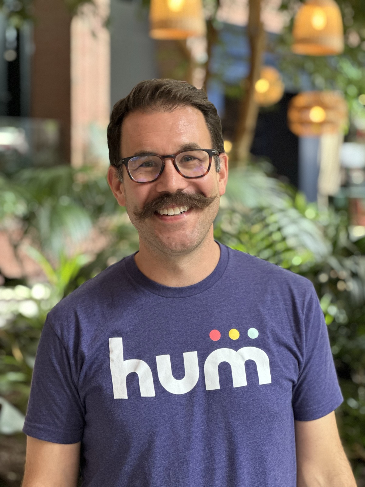 Hum co-founder and CEO Dustin Smith wearing a Hum T-shirt