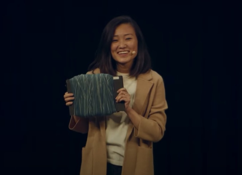 Huue cofounder Michelle Zhu presenting blue denim yarn at IndieBio Demo Day