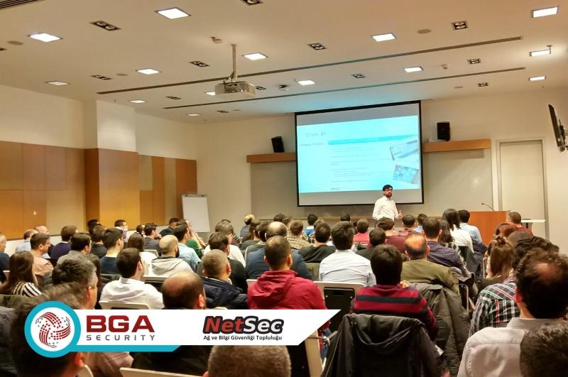 Huzeyfe Onal addressing a seated audience at a BGA NETSEC security event