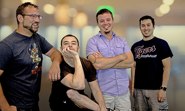 Four colleagues in a team photograph published by Chameleon Power