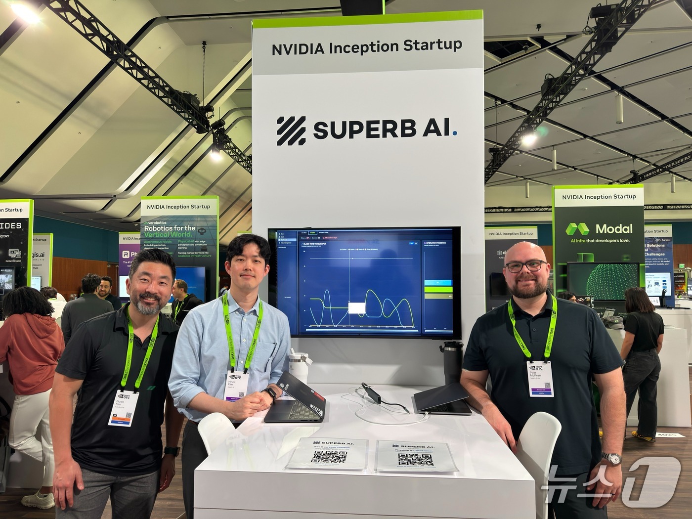 Hyun Kim seated between two Superb AI colleagues at the company's NVIDIA GTC 2026 booth