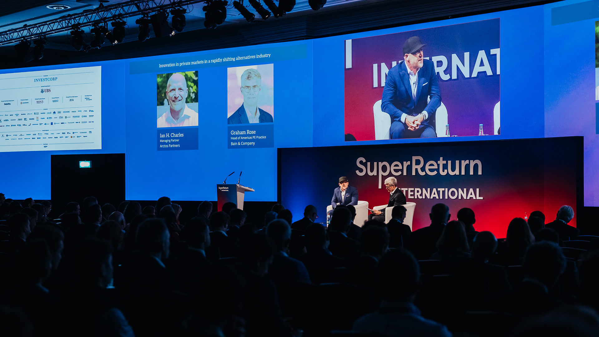 Ian Charles, left, speaking with Bain’s Graham Rose on stage at SuperReturn International 2025