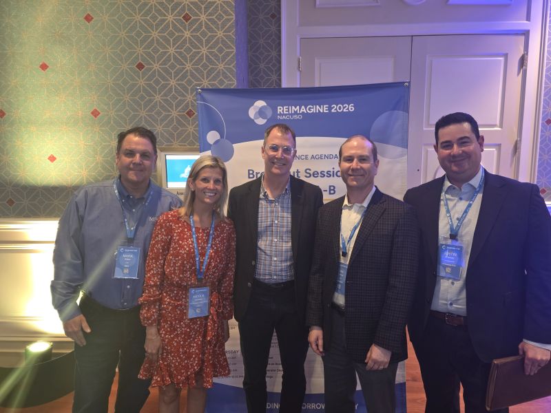 Ian Lampl, second from right, with fellow speakers and attendees at NACUSO Reimagine 2026.