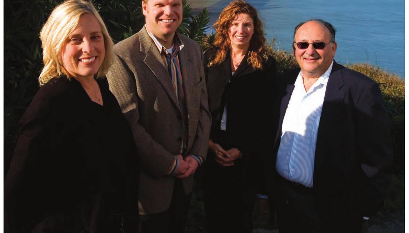 Four members of MHN's 2006 leadership team outdoors near the Golden Gate Bridge, with Ian Shaffer at right