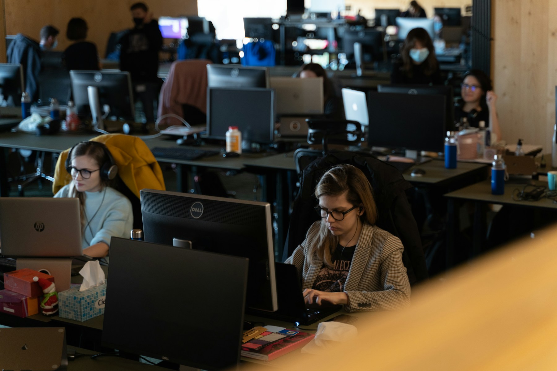 Colleagues working at computers in a modern office