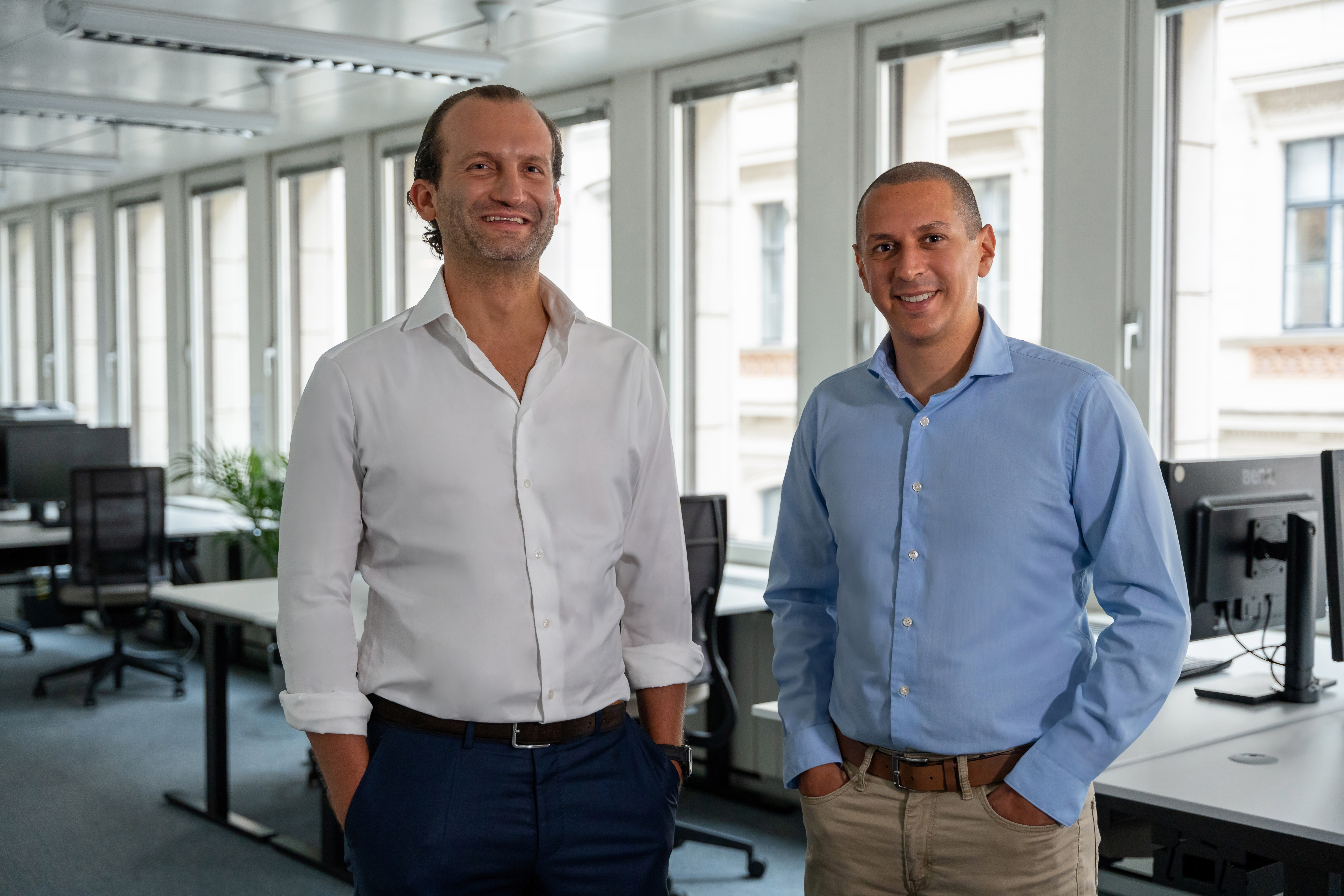 Sander van de Rijdt, left, and Ibrahim Imam, right, standing together in a PlanRadar office