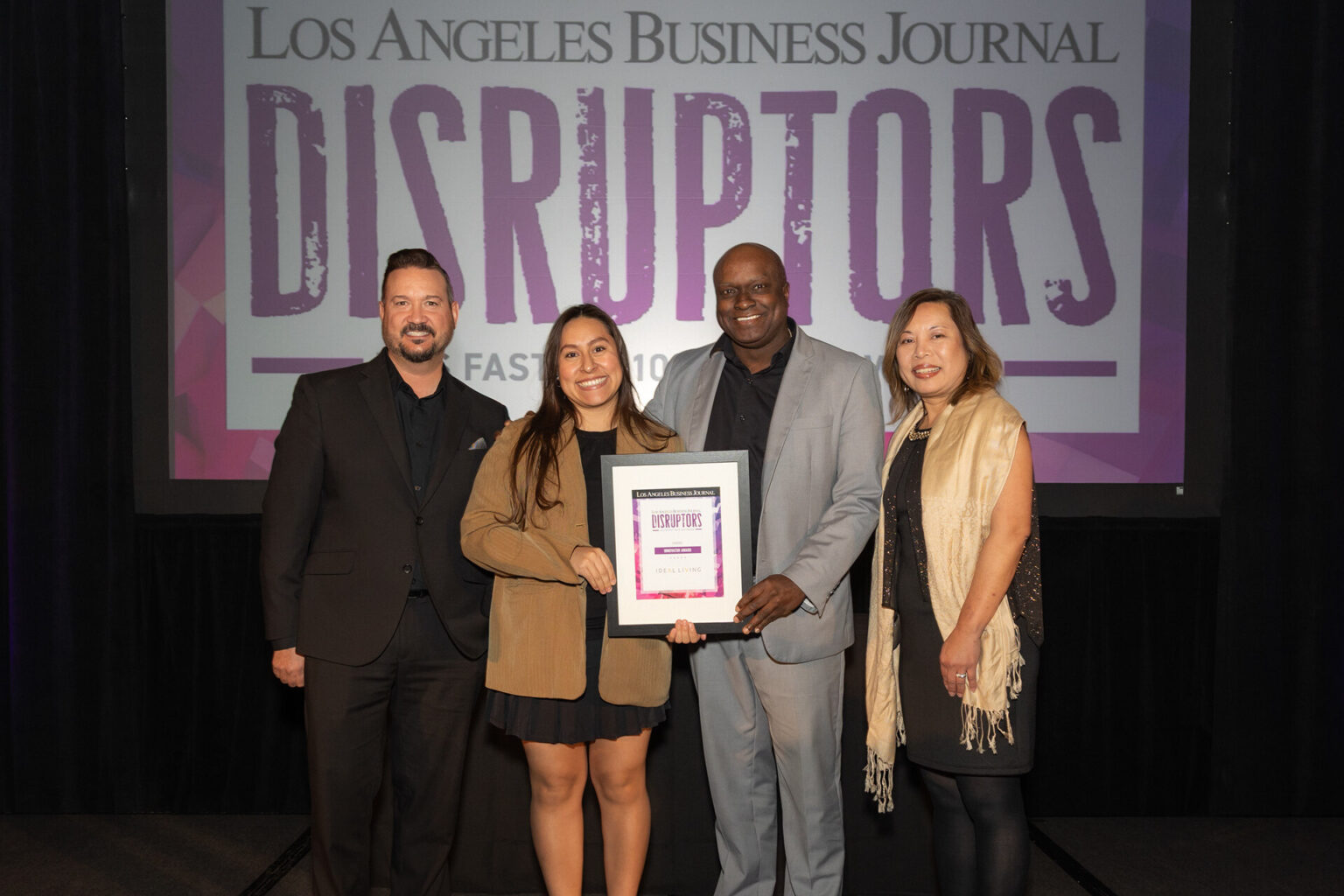 Ideal Living team accepting the Los Angeles Business Journal Disruptors award
