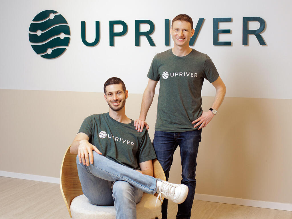 Ido Bronstein and Omri Lifshitz wearing Upriver shirts in the company office