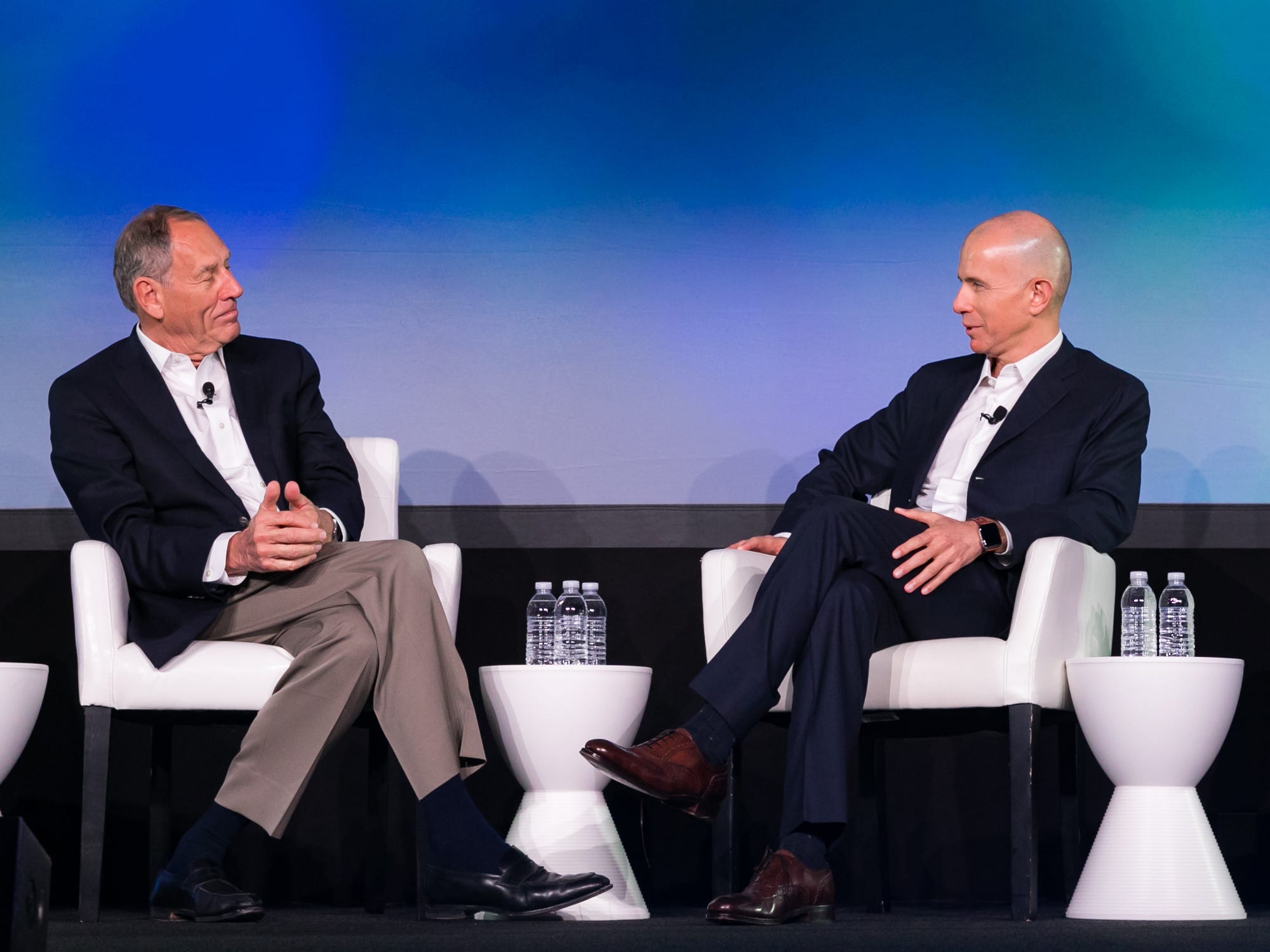Toby Cosgrove, left, and Ido Schoenberg, right, seated in conversation on a stage