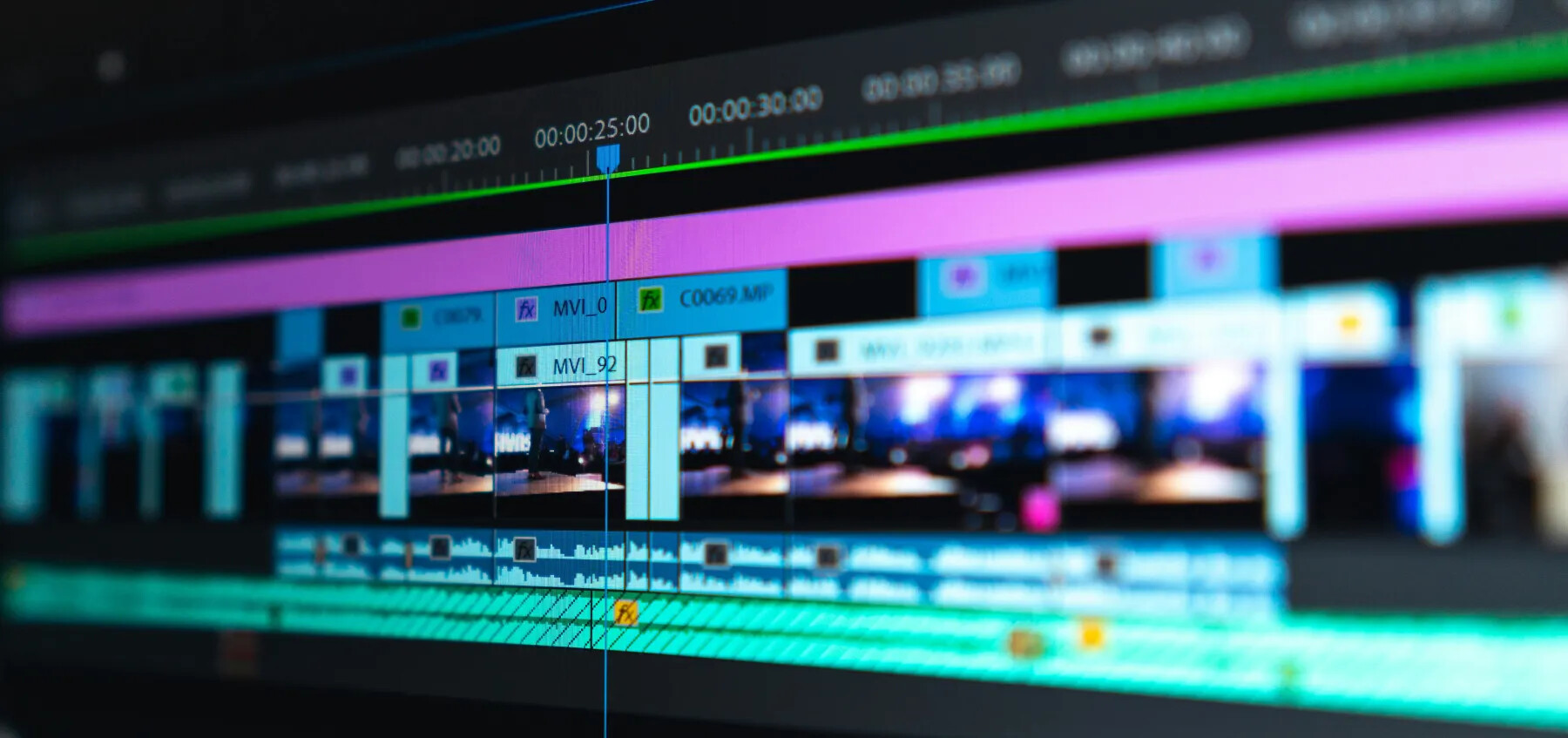 A professional video editing timeline with many separate picture and audio layers