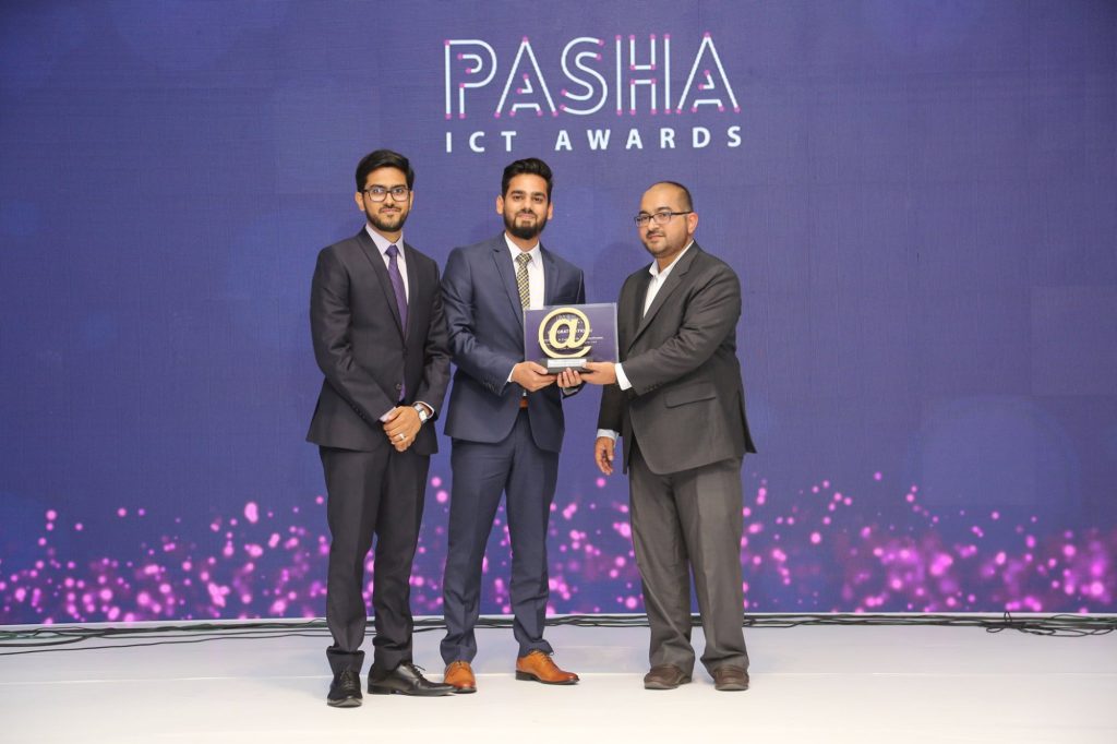 iENGINEERING team receiving a P@SHA ICT Awards plaque in 2019