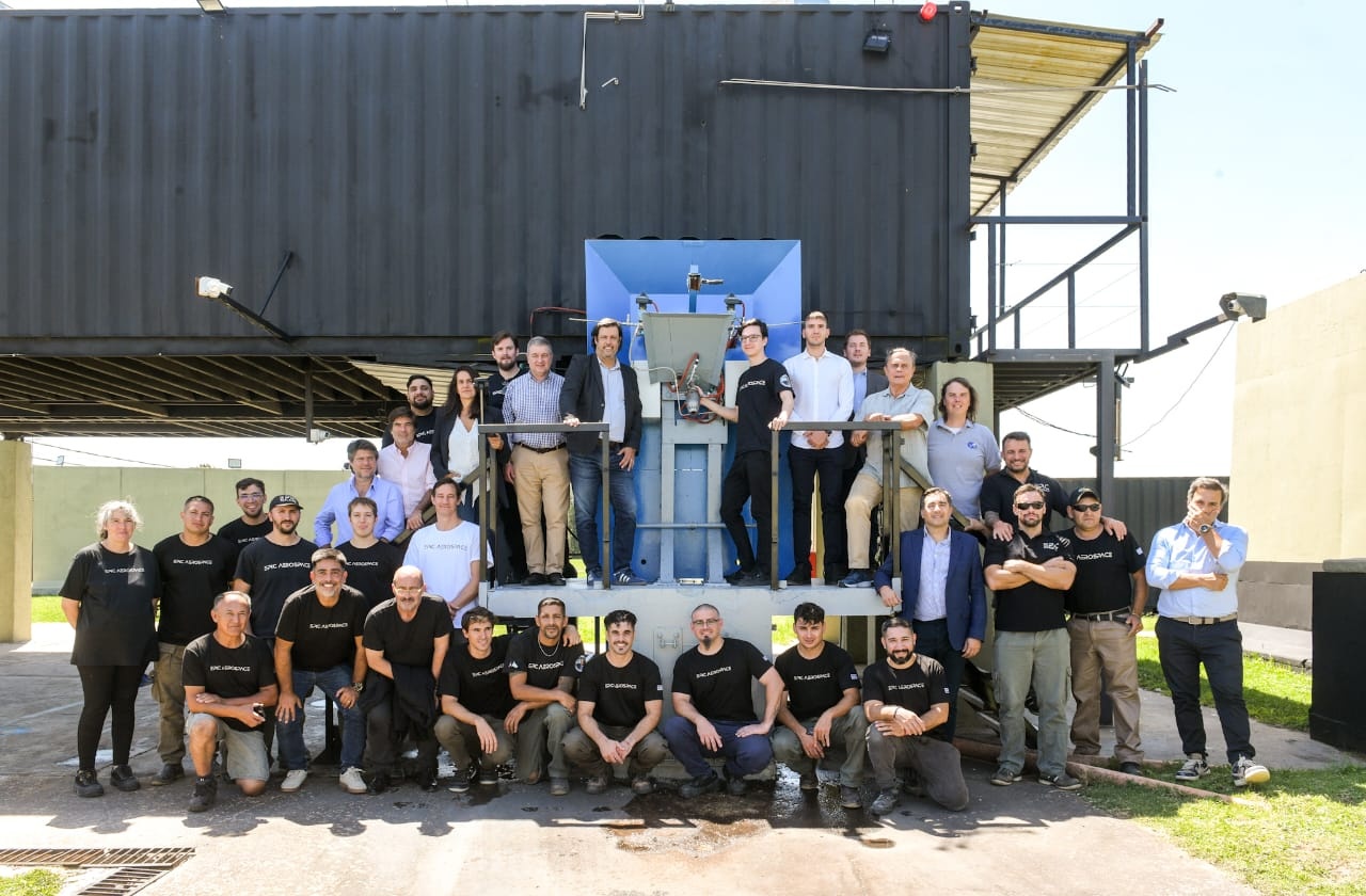 Epic Aerospace team and visiting officials gathered at the Ezeiza test facility