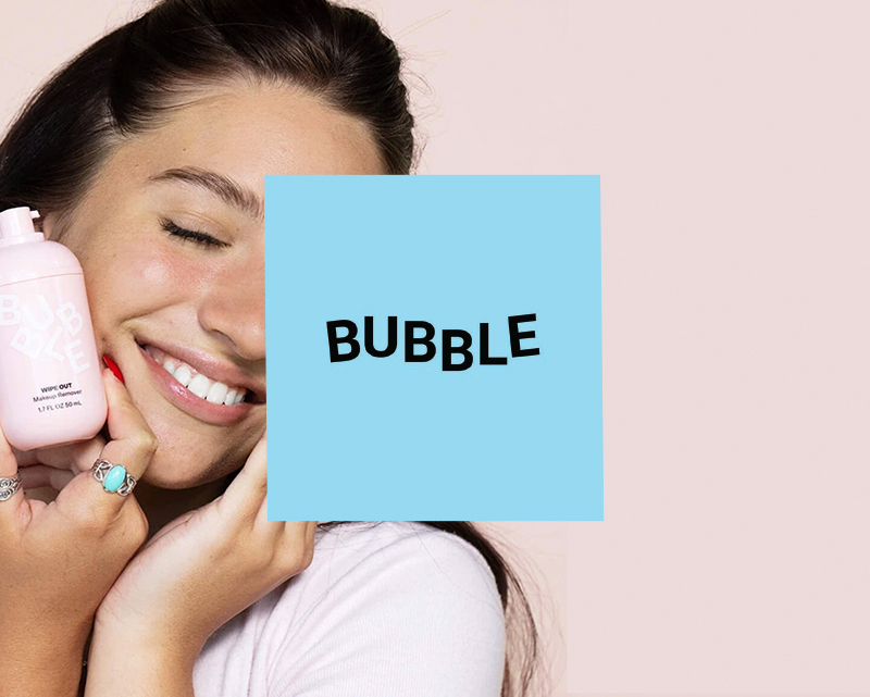 Bubble skincare portfolio photograph showing a customer holding a skincare bottle