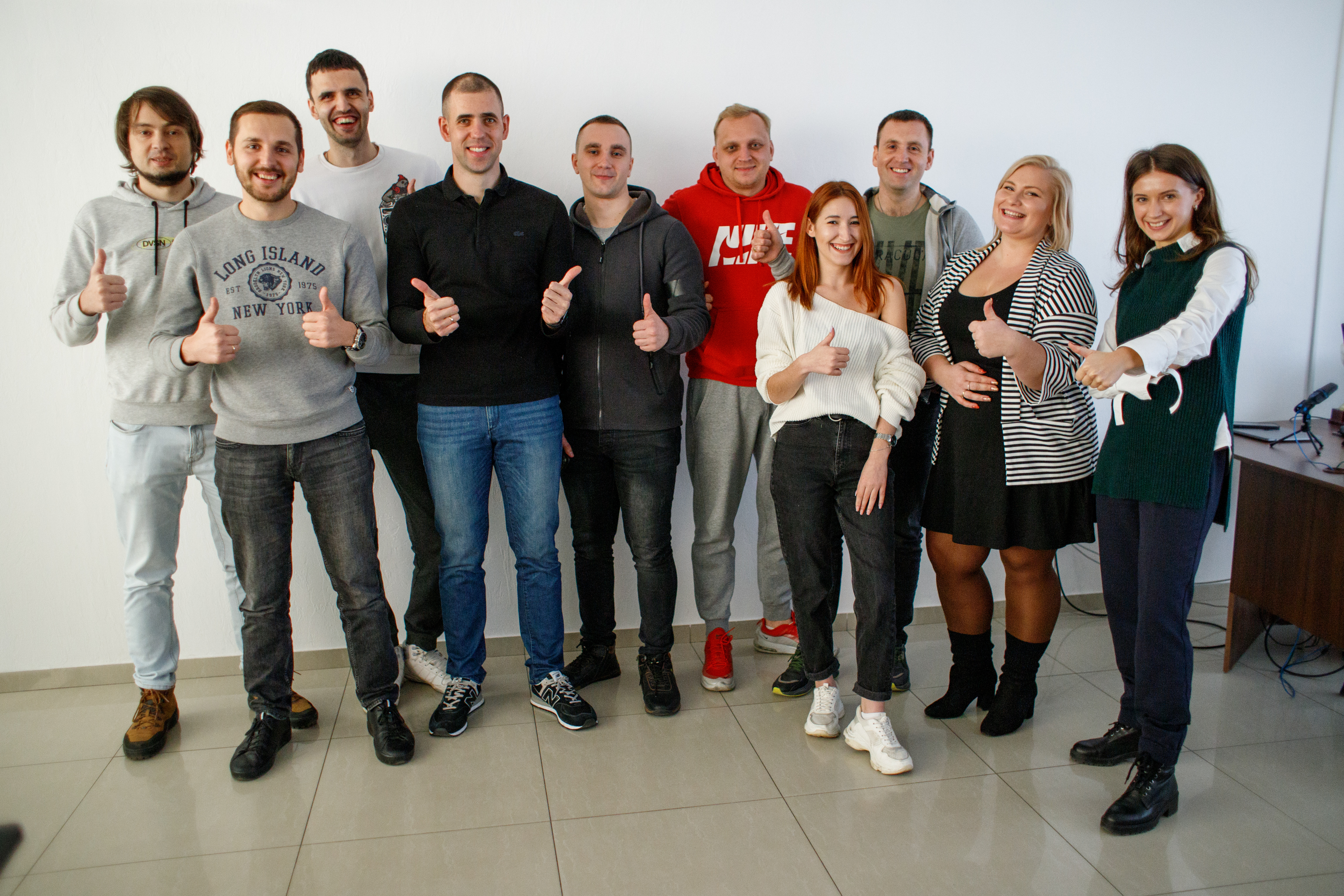 Ihor Volovoy and Elit-Web colleagues standing together in an office