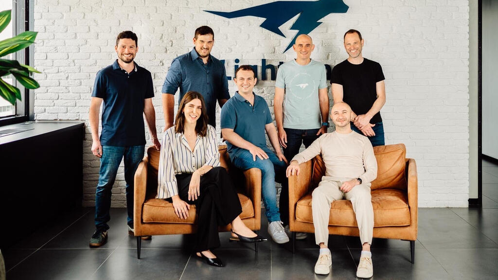 Ilan Peleg seated at the right with Lightrun co-founder Leonid Blouvshtein and members of the leadership team