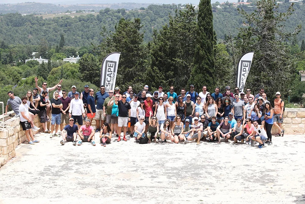 Illusive employees gathered outdoors for a team photograph