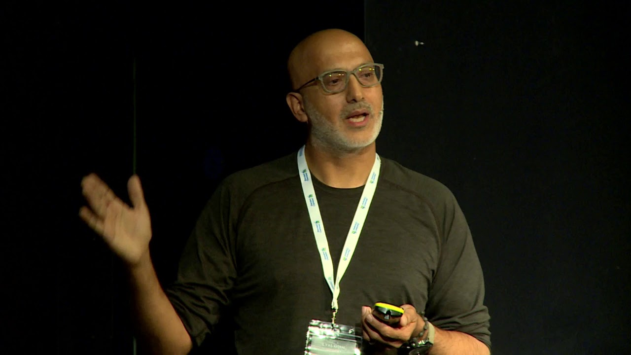 Ilyas Khan speaking onstage during his TEDxCityUniversityLondon talk