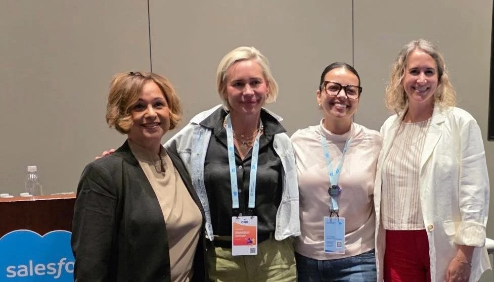 Four conference attendees pictured at Salesforce Connections, as published in ImagineCRM’s July 2026 newsletter