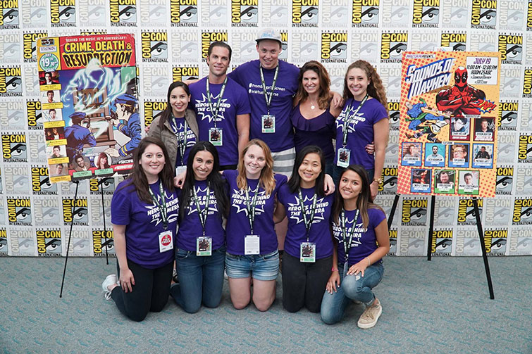 Impact24 PR team posing at San Diego Comic-Con in matching purple shirts