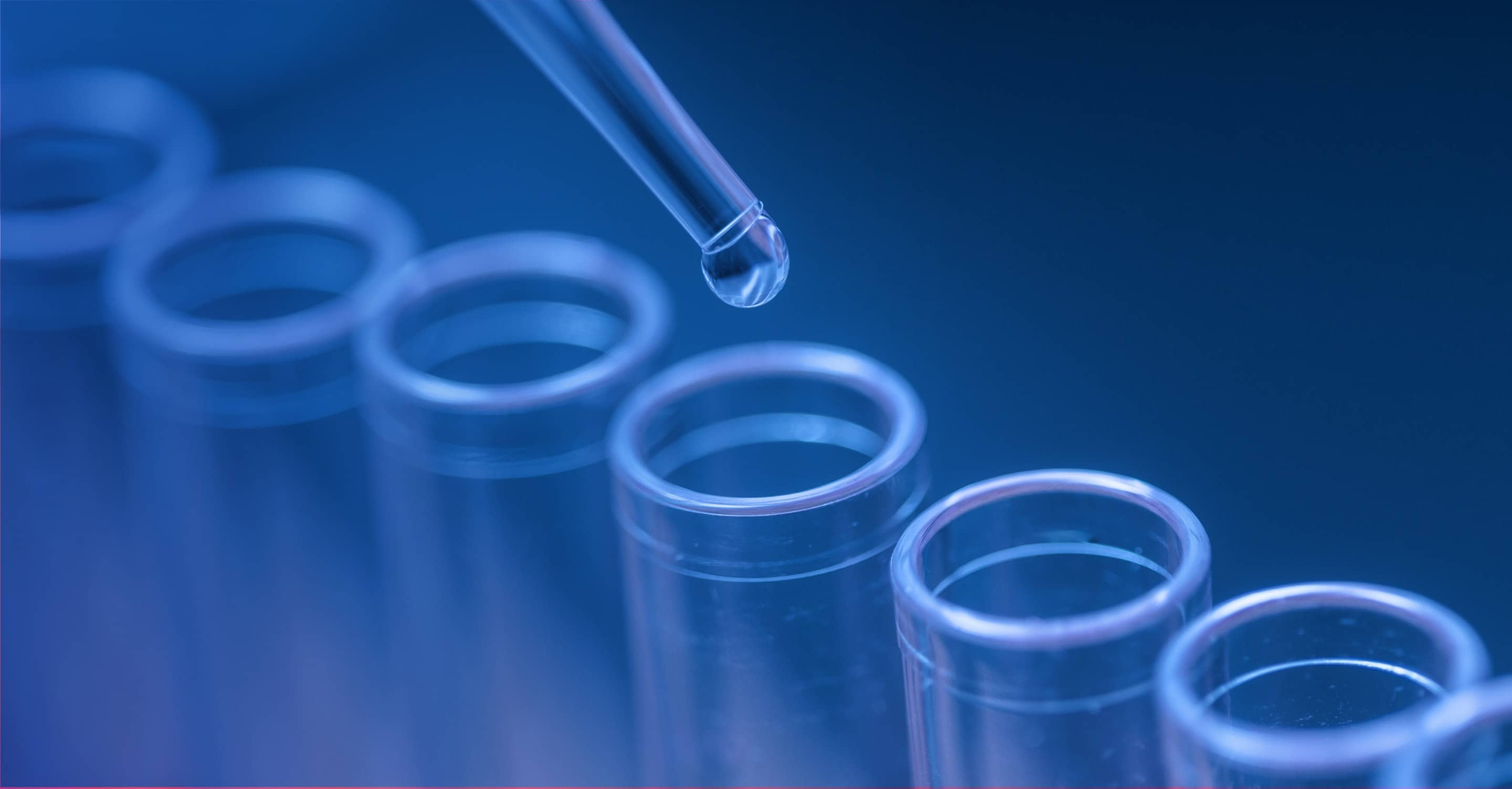 A precision pipette dispensing liquid during a laboratory experiment