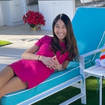 Jessica Mah, indinero co-founder, seated outdoors
