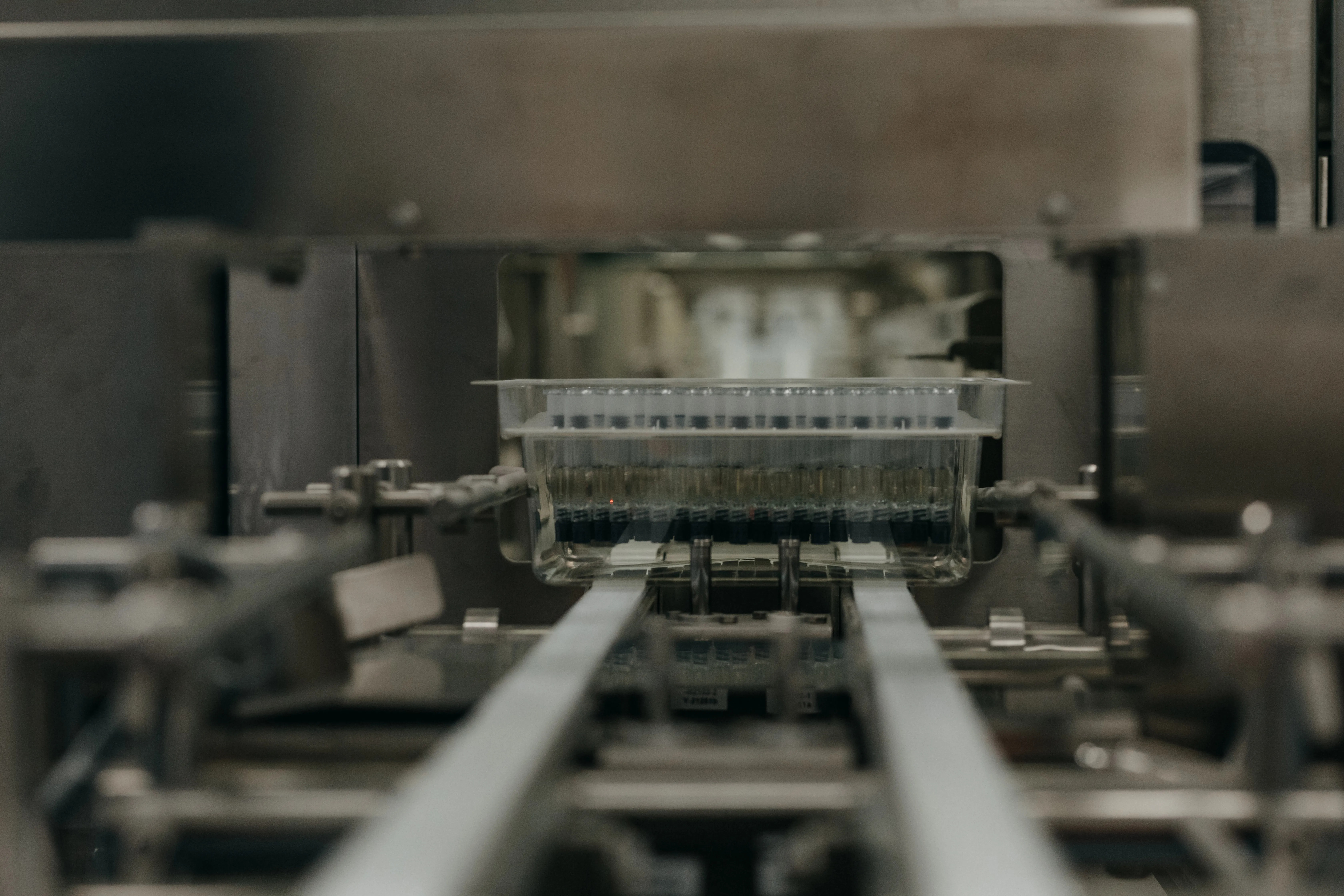 Vials arranged along equipment in an Indivior press photograph