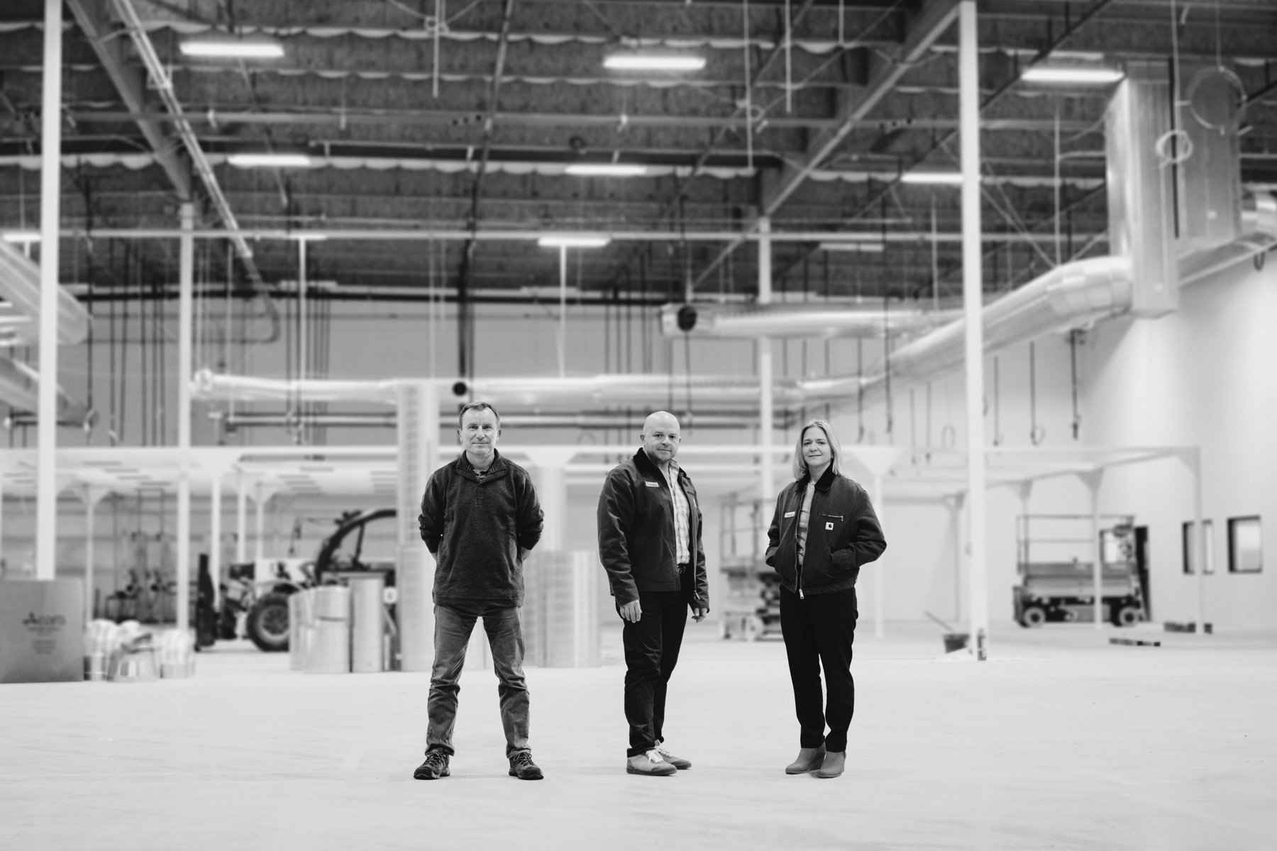 Inertia co-founders Mike Dunne, Jeff Lawson and Annie Kritcher in a large industrial facility