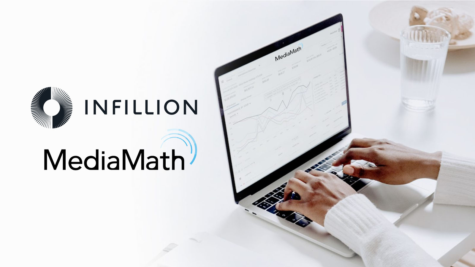 A person working at a laptop beside the Infillion and MediaMath names