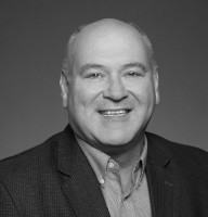 Black-and-white portrait of Phil Bullinger, Infinidat general manager