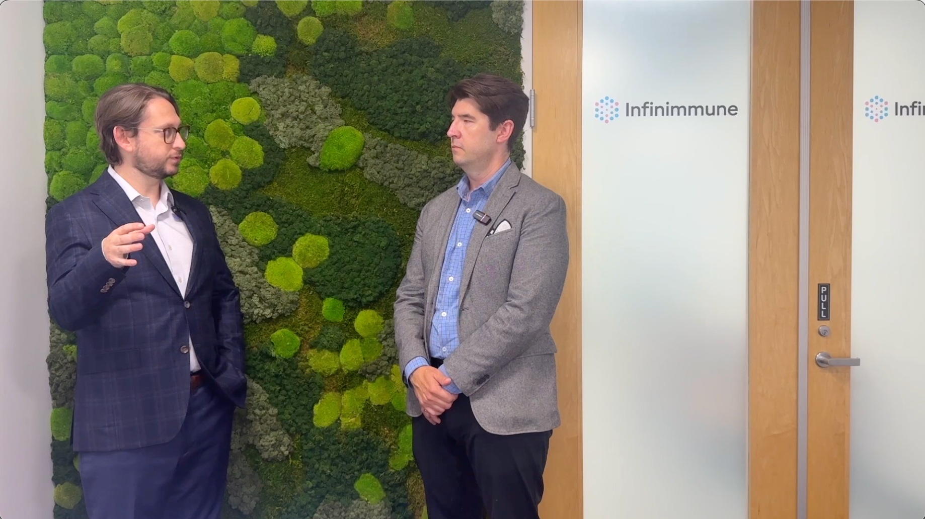 Wyatt McDonnell speaking with an interviewer at the Infinimmune office