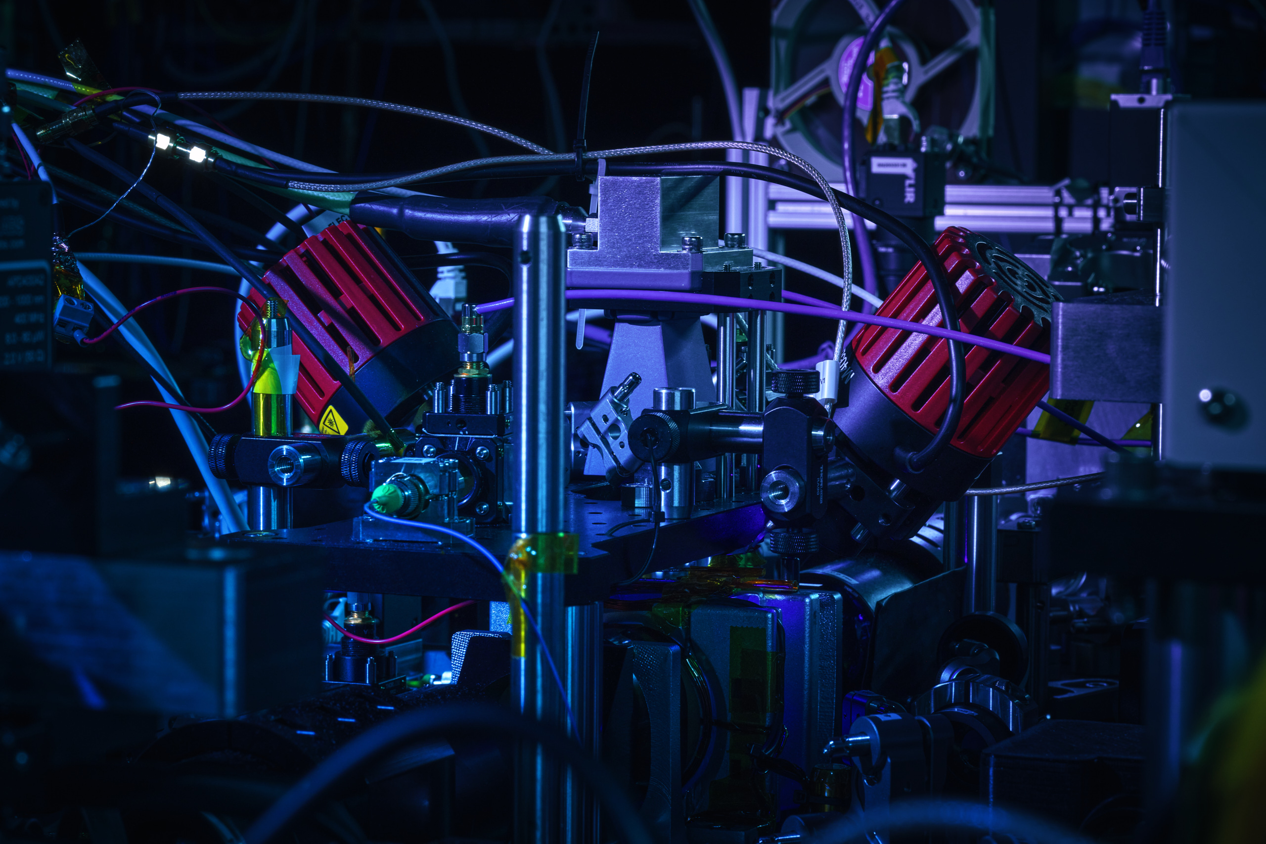 Optical components, cables and vacuum hardware inside Infleqtion quantum computing equipment